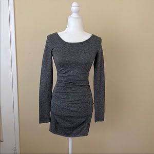 Charcoal gray bodycon dress with black color block back.